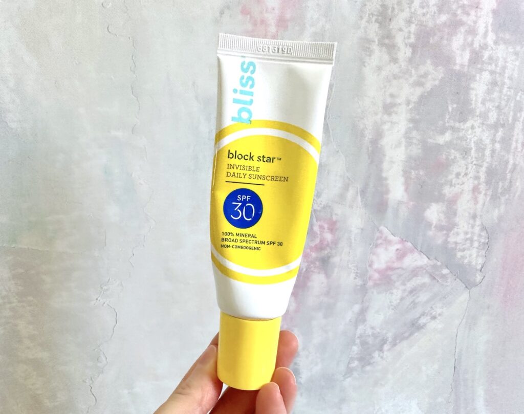 Bliss Block Start invisible Daily Sunscreen SPF 30, handheld.