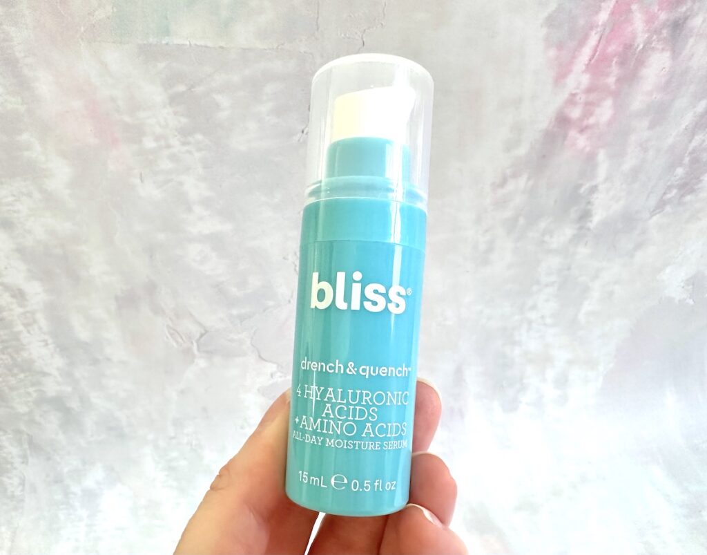 Bliss Drench and Quench Serum, handheld.