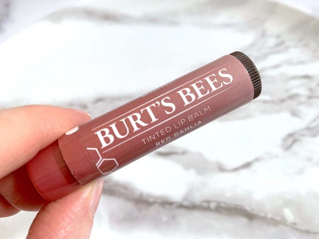 Burt's Bees Tinted Lip Balm in Red Dahlia handheld.