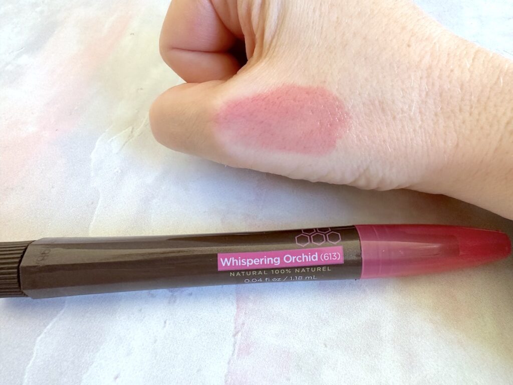 Burt's Bees Tinted Lip Oil in the shade Whispering Orchid, sampled on hand.