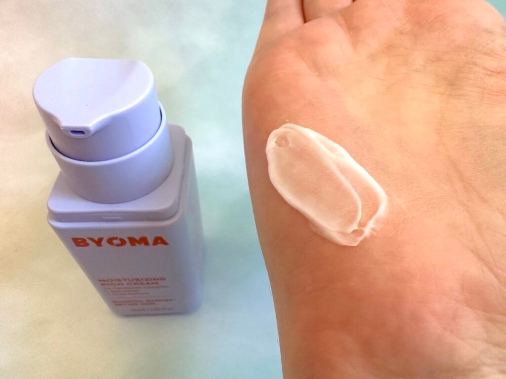 Byoma Moisturizing Rich Cream bottle and sampled on palm of hand.