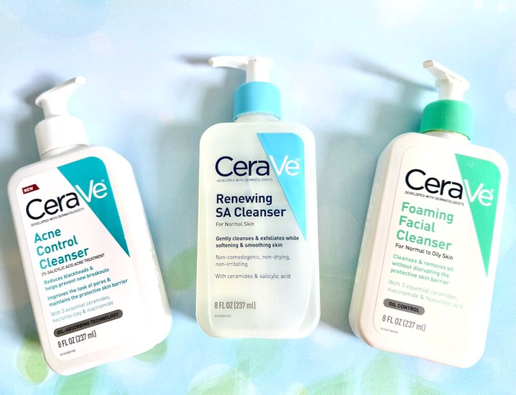 Flatlay of CeraVe Acne Control Cleanser, CeraVe Renewing SA Cleanser, and CeraVe Foaming Facial Cleanser.