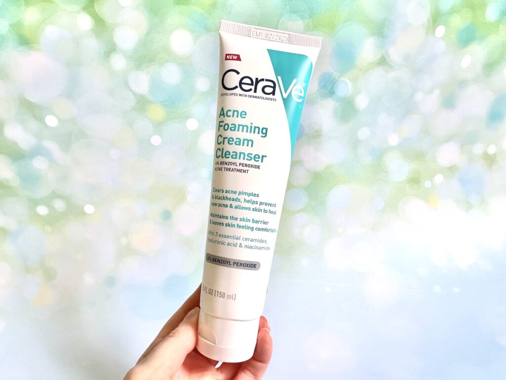 CeraVe Acne Foaming Cream Cleanser, handheld.