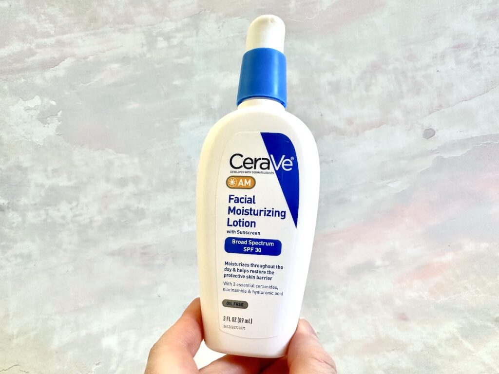 CeraVe AM Facial Moisturizing Lotion with Sunscreen, handheld.