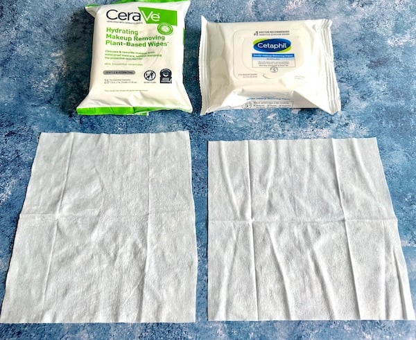 CeraVe Hydrating Makeup-Removing Plant-Based Wipes and Cetaphil Gentle Makeup Removing Wipes, with wipe samples in front.