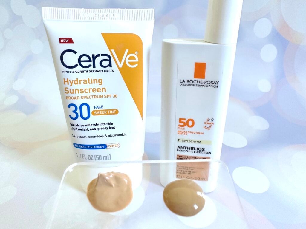 CeraVe Hydrating Mineral Sunscreen SPF 30 Face Sheer Tint vs La Roche-Posay Anthelios Tinted Sunscreen SPF 50, bottles next to samples on clear plastic spatula.