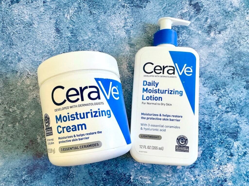 CeraVe Moisturizing Cream vs Lotion: Cream and Daily Moisturizing Lotion flatlay on blue background.