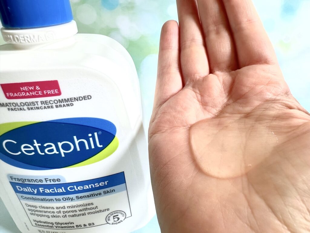 Cetaphil Daily Facial Cleanser bottle next to sample of gel in palm of hand.