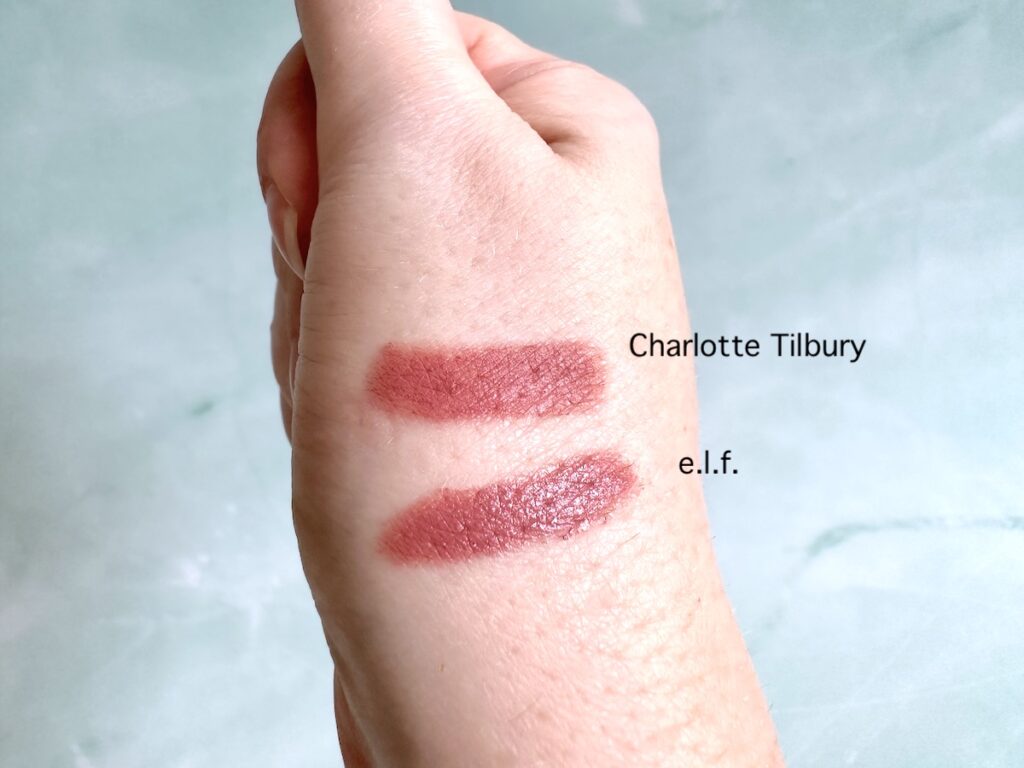 Charlotte Tilbury Pillow Talk lipstick and e.l.f O Face Satin Lipstick in Dirty Talk, sampled on hand.