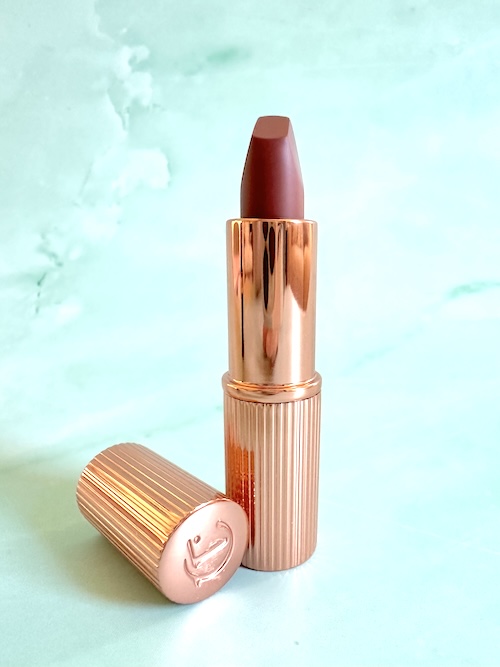 Charlotte Tilbury Pillow Talk Medium Lipstick, cap removed.