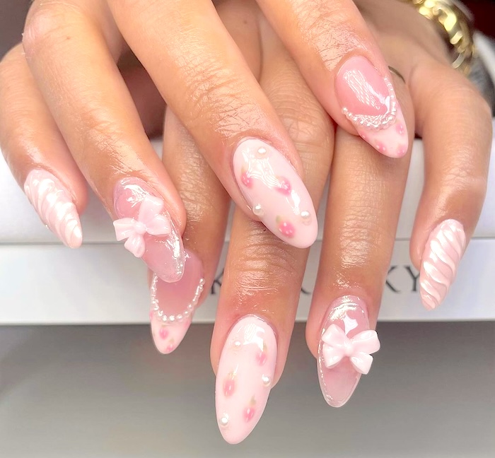 Pink coquette nails.