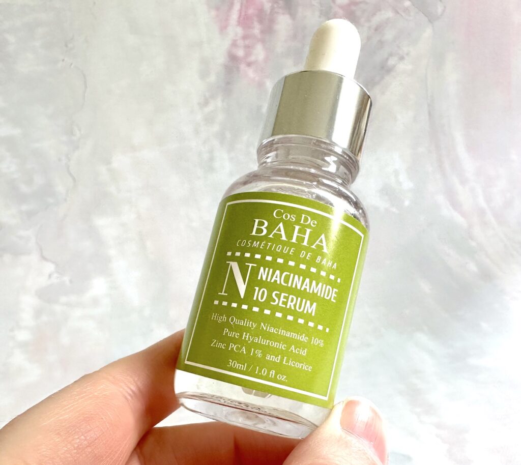 Cos De Baha Niacinamide 10% + Zinc PCA 1% Serum, handheld.