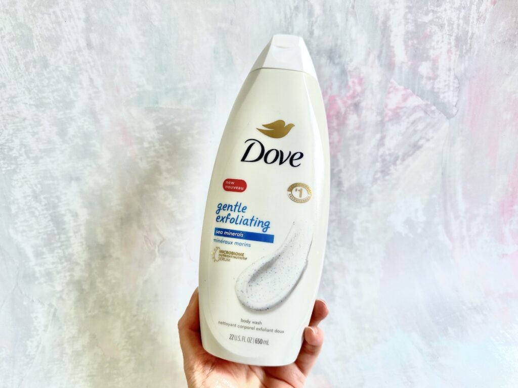 Dove Gentle Exfoliating Body Wash with Sea Minerals, handheld.