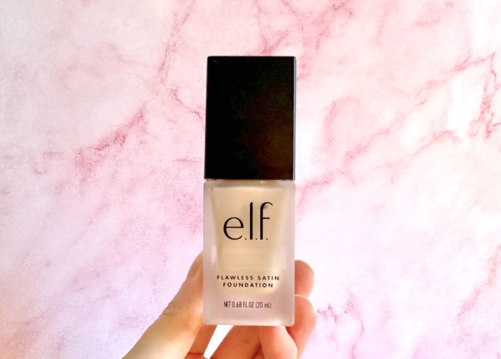 e.l.f. Flawless Satin Foundation in the shade 220 Beige, handheld.