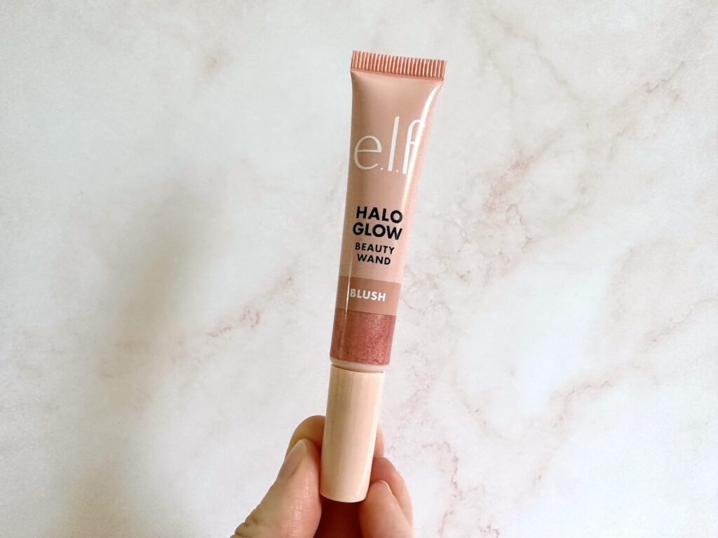 e.l.f. Halo Glow Blush Beauty Wand in the shade Candlelit, handheld.