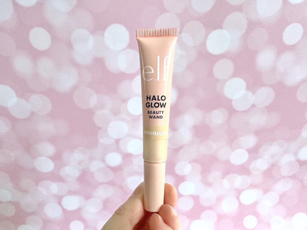 e.l.f. Halo Glow Highlight Beauty Wand in the shade Champagne Campaign, handheld.