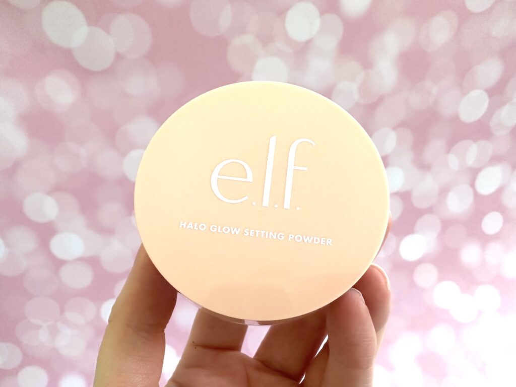 e.l.f. Halo Glow Loose Setting Powder in the shade Light, handheld.