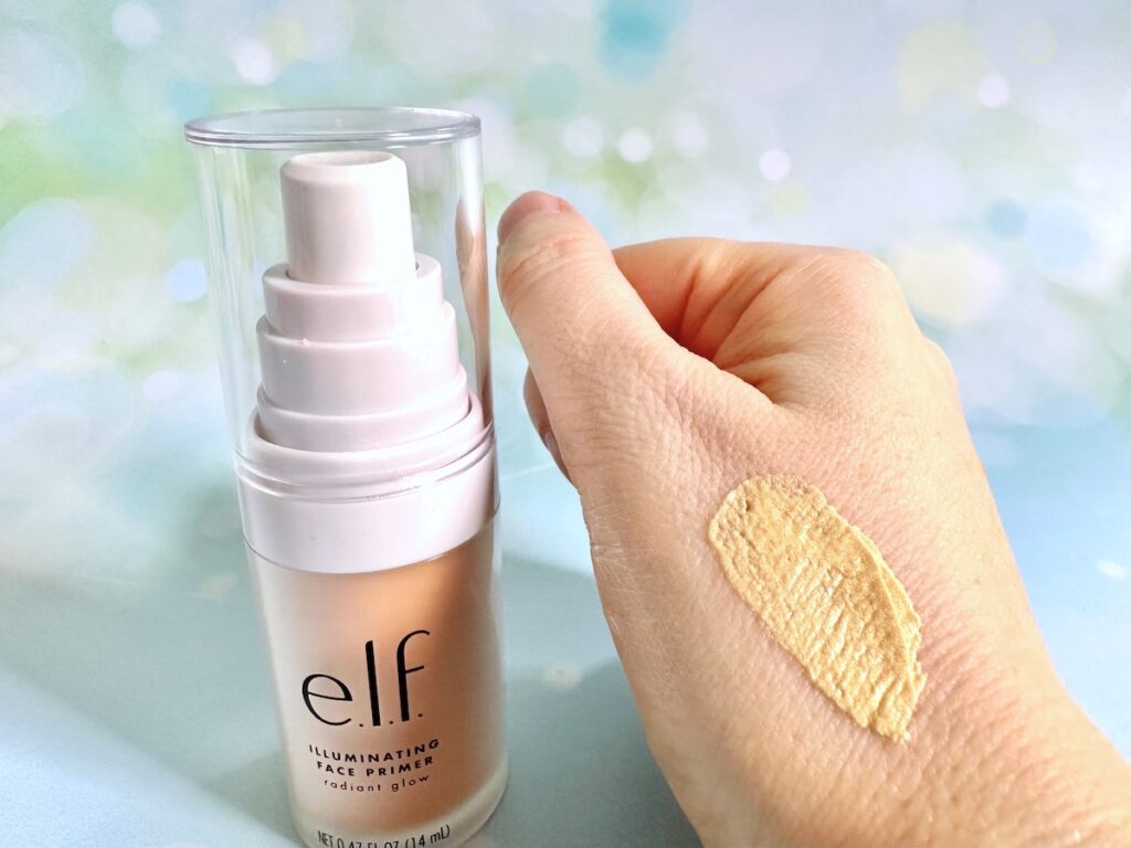 e.l.f. Illuminating Face Primer bottle next to sample on hand.