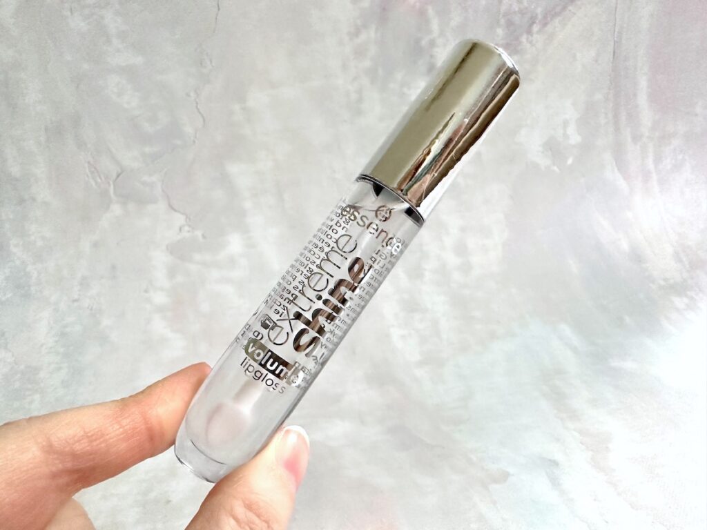 Essence Extreme Shine Volume Lip Gloss in the shade Crystal Clear, handheld.