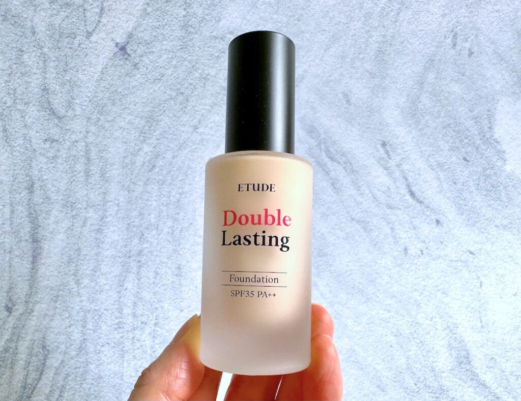 Etude House Double Lasting Foundation in the shade Light Vanilla, handheld.