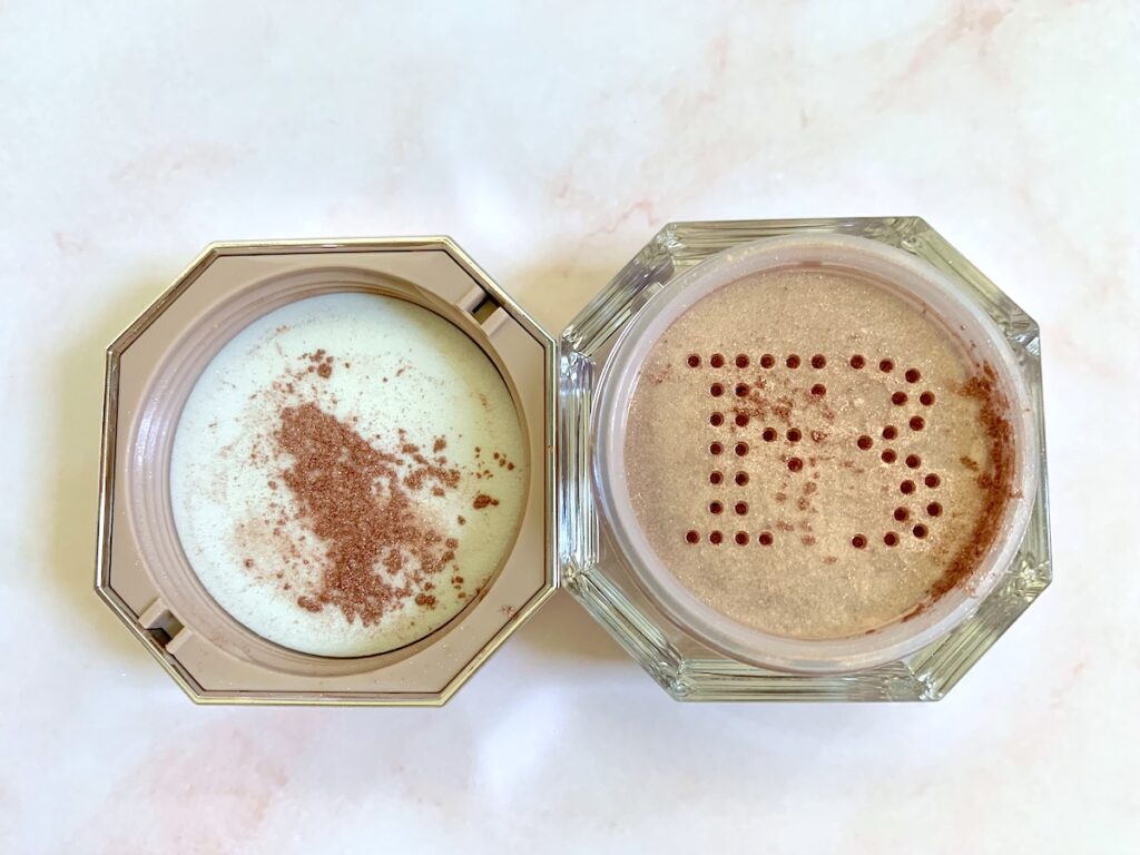 Fenty Beauty Fairy Bomb Shimmer Powder in Rosé On Ice opened and sampled in lid.