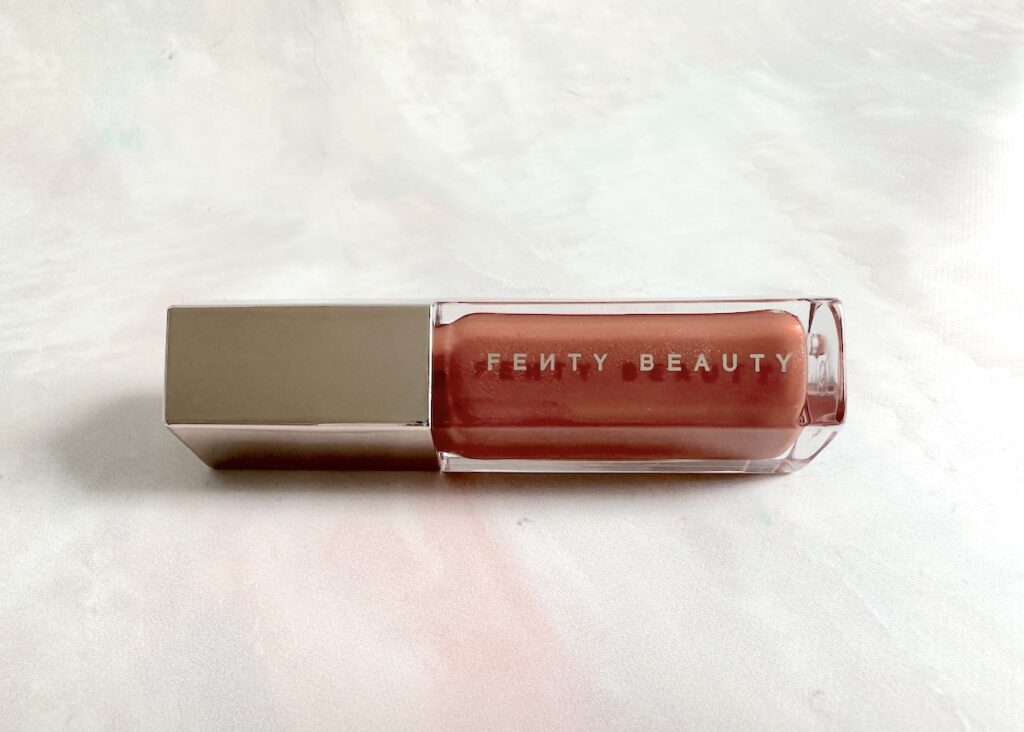 Fenty Gloss Bomb Universal Lip Luminizer in the shade Fenty Glow.