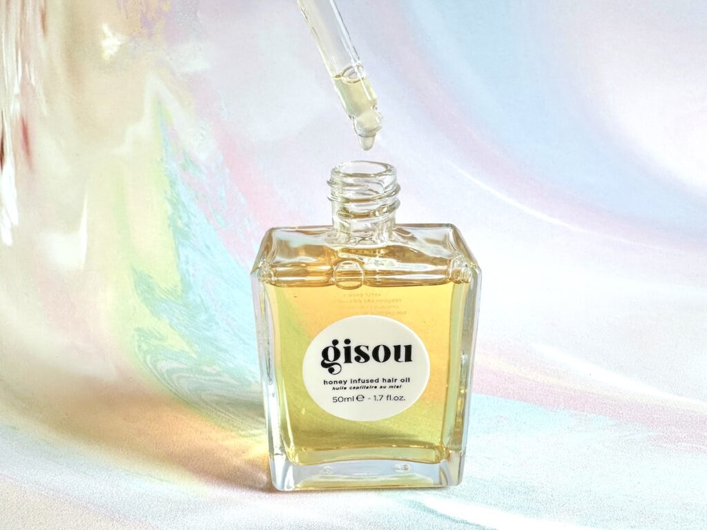 Gisou Honey Infused Hair Oil, open bottle with dropper.