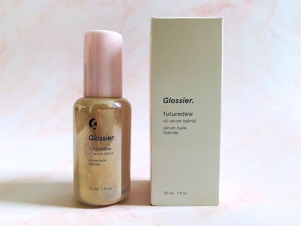 Glossier Future Dew Oil Serum Hybrid with box on pink background