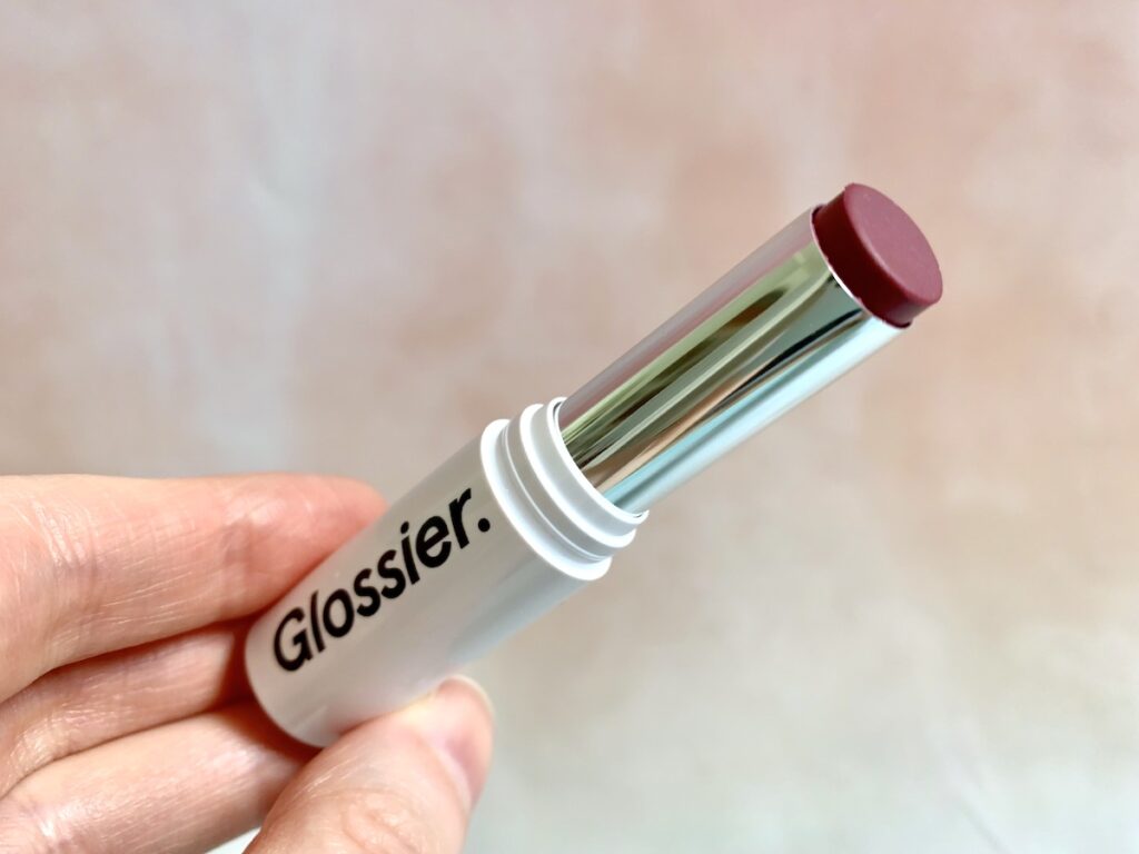 Glossier Generation G Sheer Matte Lipstick opened in the shade Like.