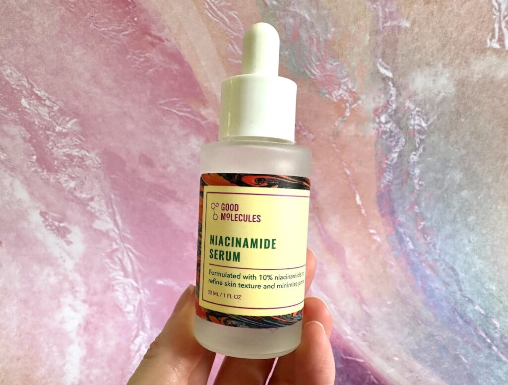 Good Molecules Niacinamide Serum, handheld.