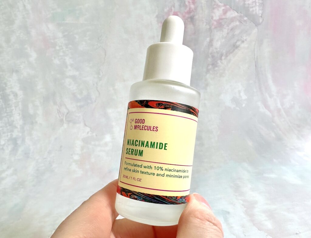 Good Molecules Niacinamide Serum, handheld.