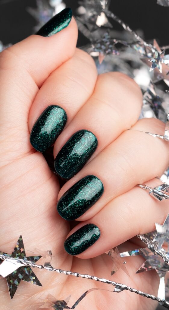 Emerald green glittery winter nails.