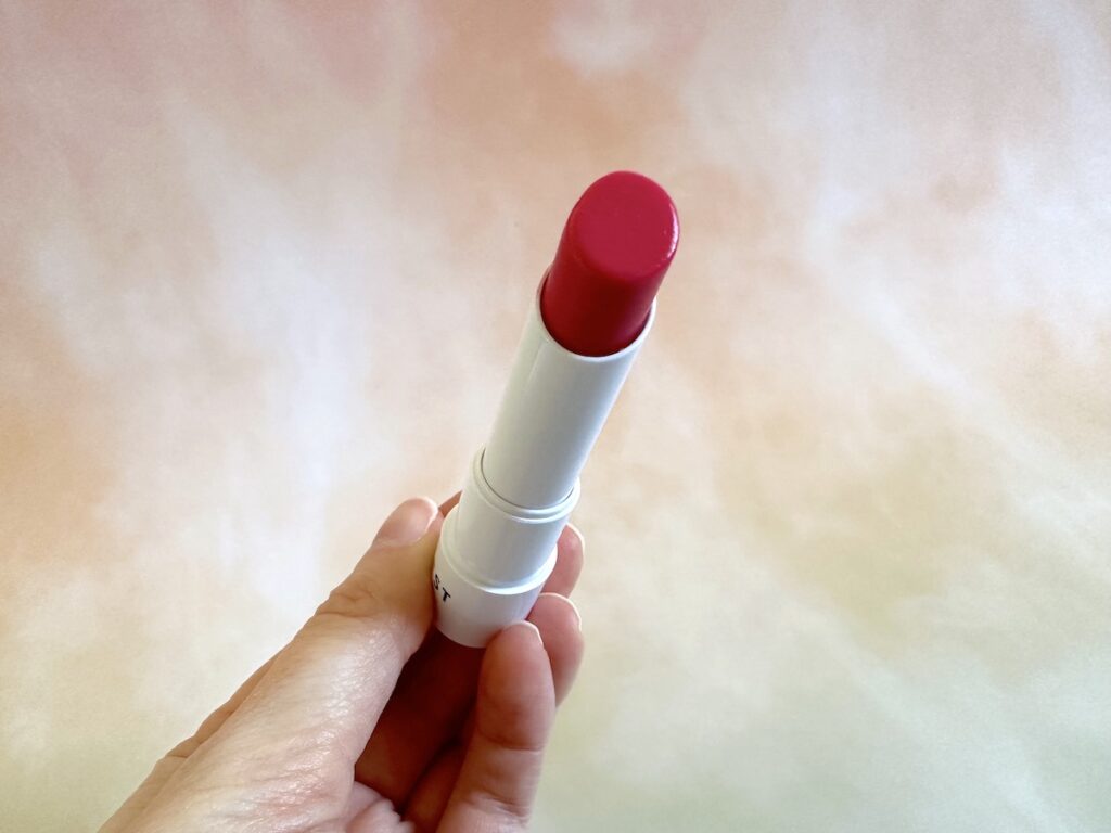 Honest Beauty Tinted Lip Balm in the shade Dragon Fruit.