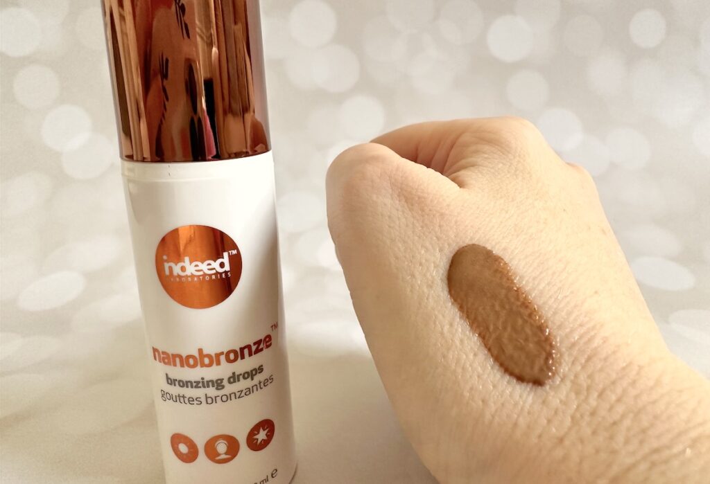 Indeed Labs Nanobronze Bronzing Drops, bottle next to sample on hand.