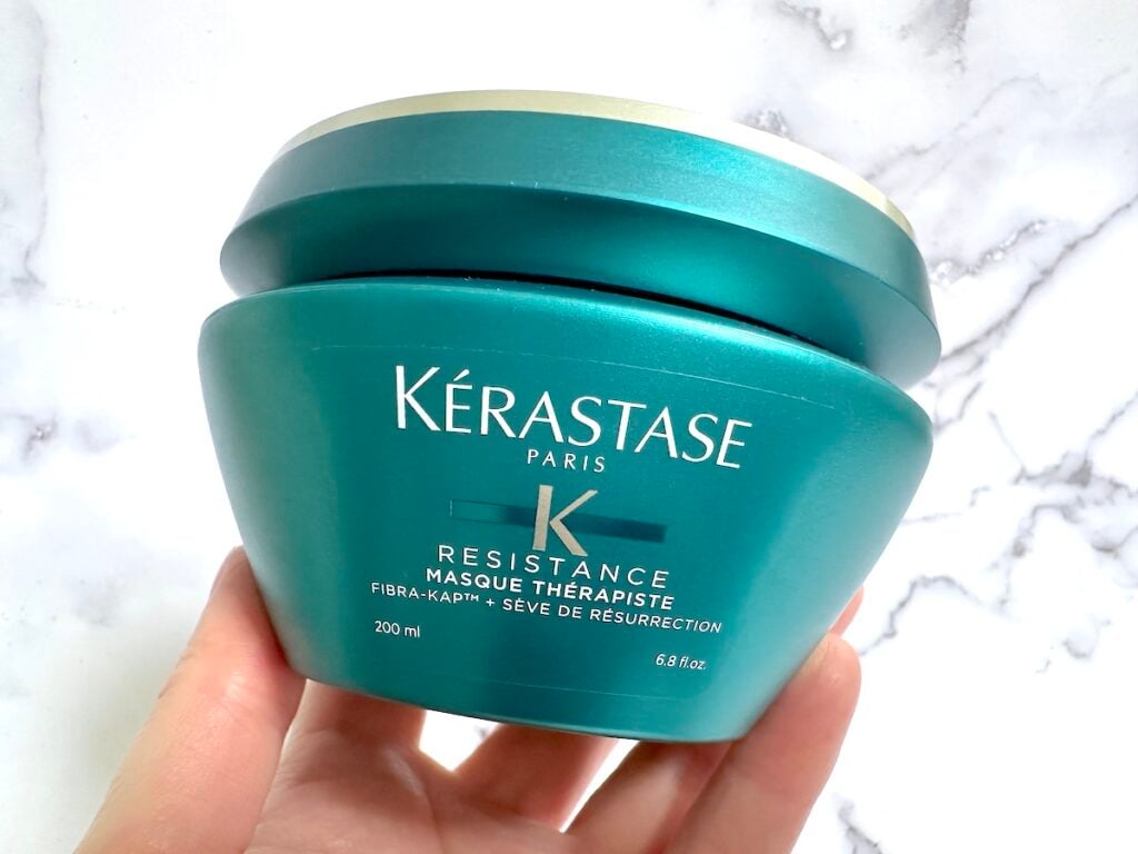 Kerastase Resistance Masque Therapiste Hair Mask handheld.