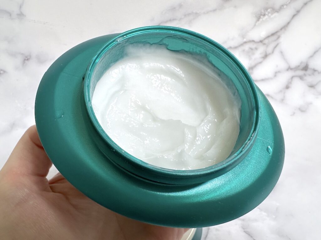 Kerastase Resistance Masque Therapiste Hair Mask open jar handheld.