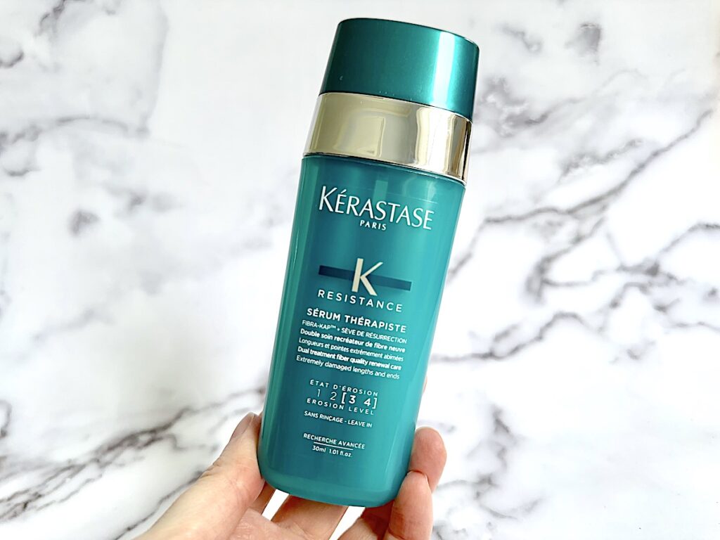 Kerastase Resistance Sérum Thérapiste Hair Serum handheld.