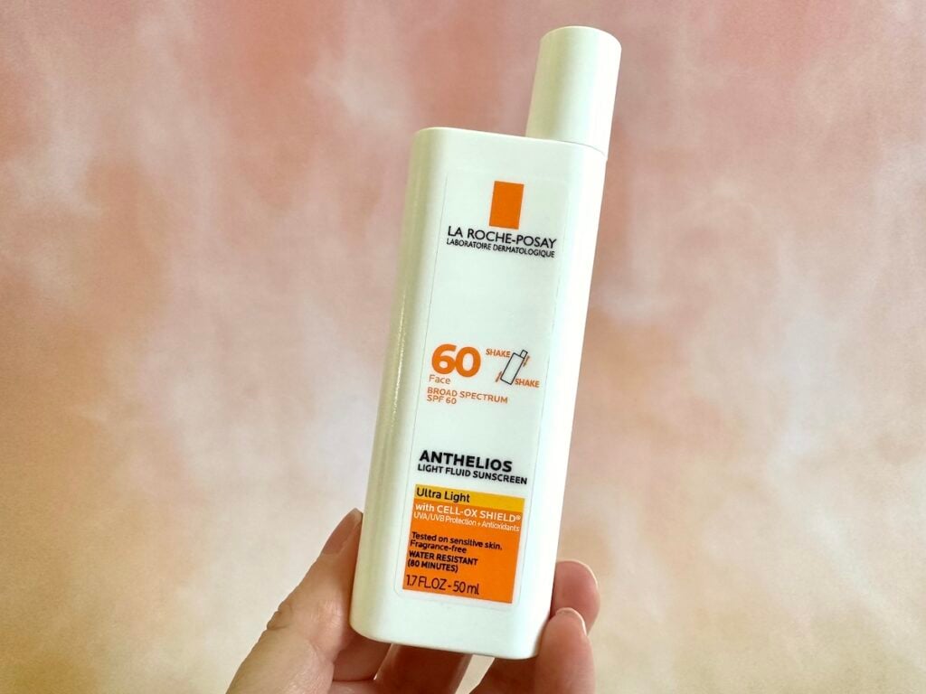 La Roche-Posay Anthelios Light Fluid Sunscreen SPF 60, handheld.