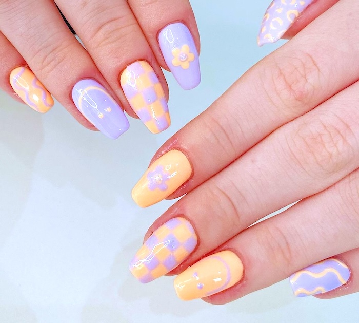 Lavender peach nails with nail art.