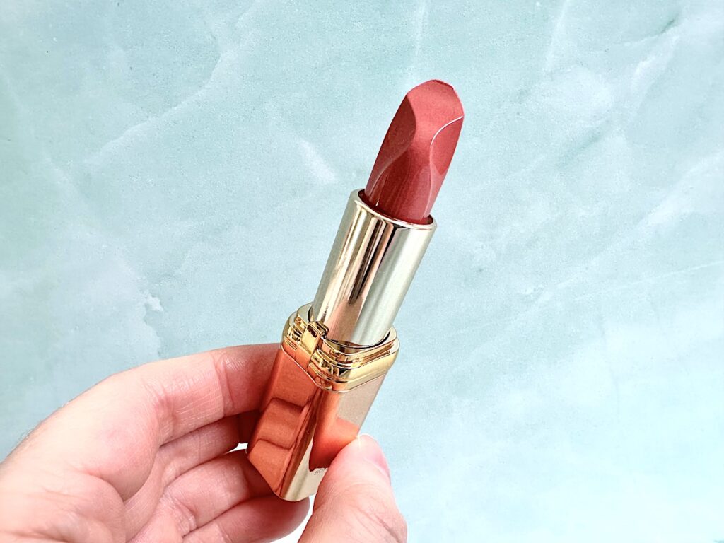 L’Oreal Paris Color Riche Les Nus Satin Lipstick in Nu Confident, handheld.