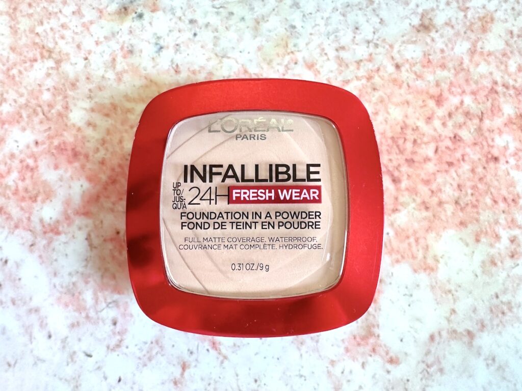 L'Oreal Infallible 24H Fresh Wear Foundation in a Powder in the shade True Beige, flatlay.