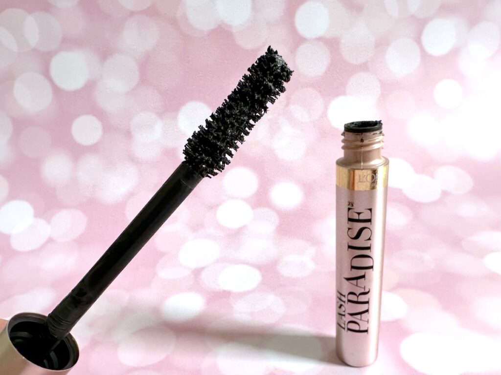 L'Oreal Lash Paradise Mascara in the shade Black Brown, open tube with mascara wand.