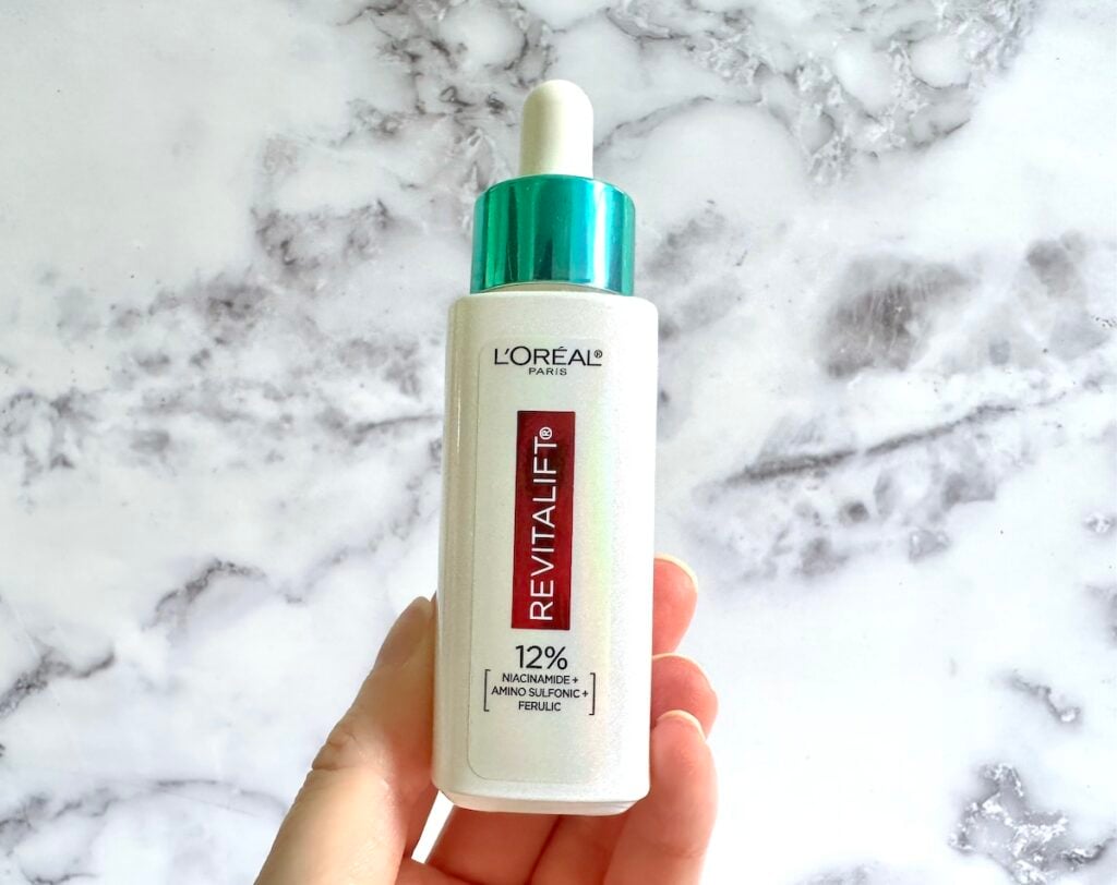 L'Oreal 12% [Niacinamide Amino Sulfonic and Ferulic Acid Dark] Spot Serum, handheld.