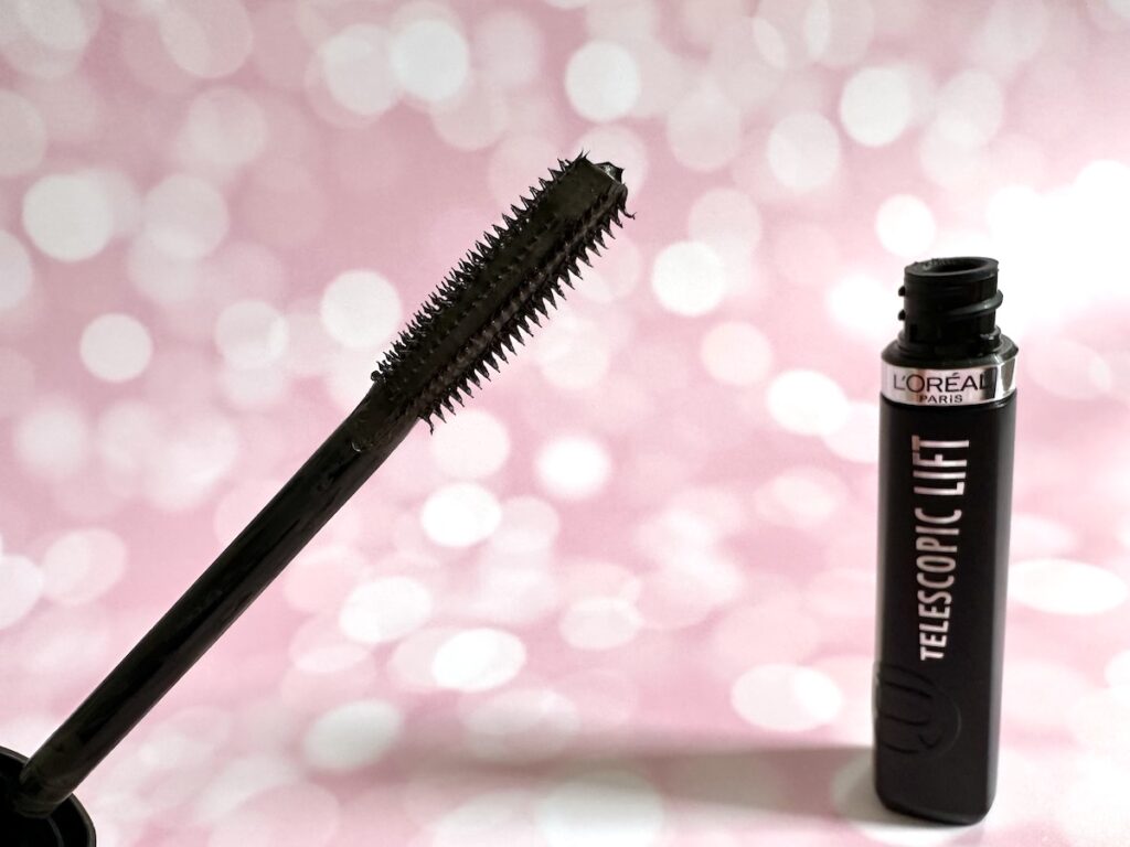 L'Oreal Telescopic Lift Washable Mascara in the shade Black Brown, open tube and longer bristles side of mascara wand.