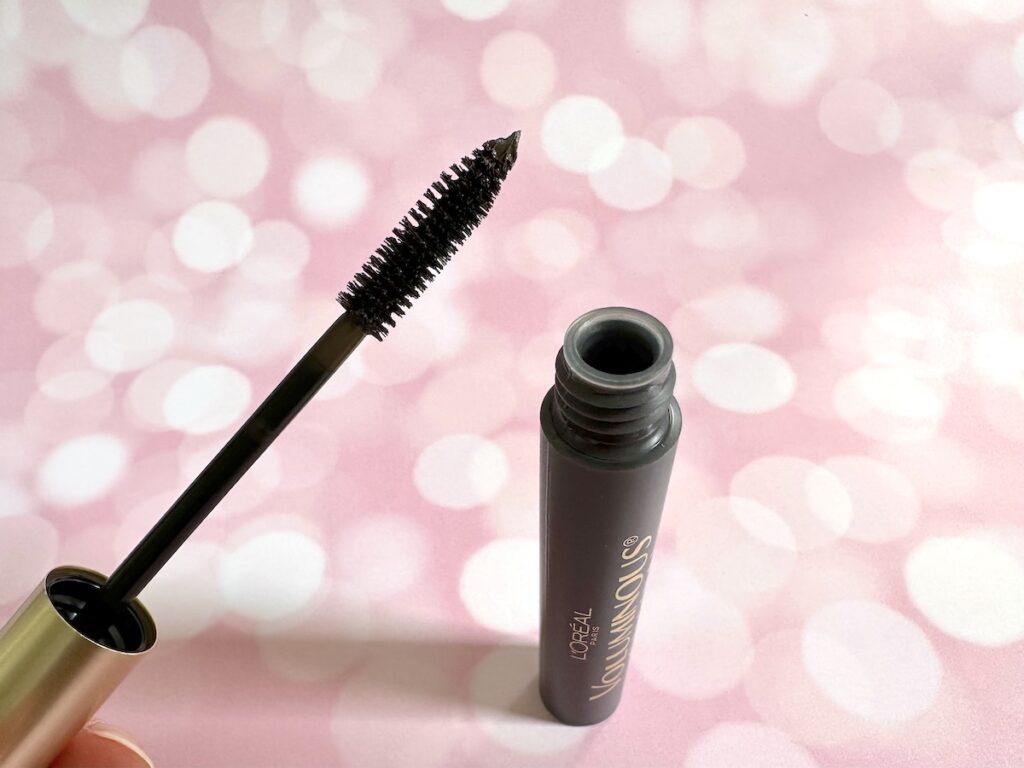 L'Oreal Voluminous Original Washable Mascara in the shade Black Brown, open tube with mascara wand.