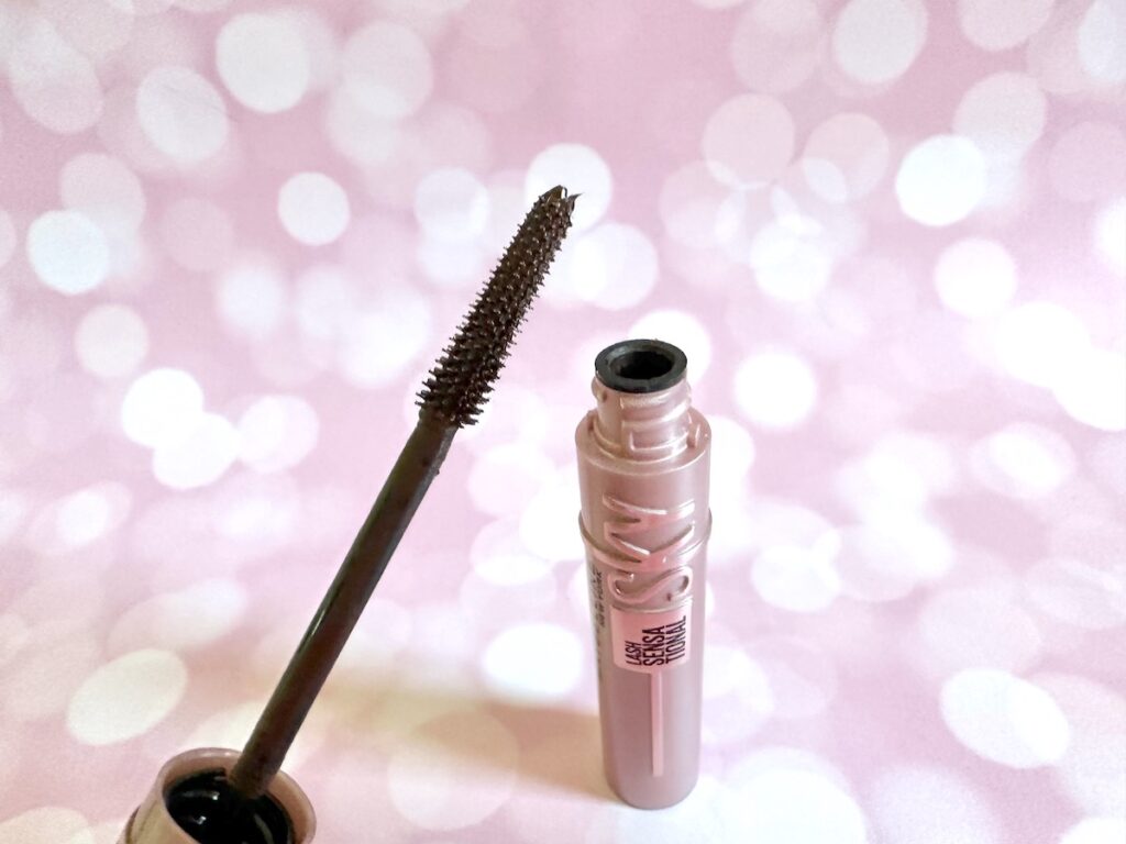 Maybelline Lash Sensational Sky High Mascara in the shade True Brown, open tube with mascara wand.