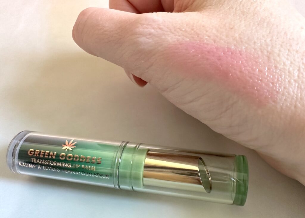 Milani Green Goddess Transforming Lip Balm sampled on hand.