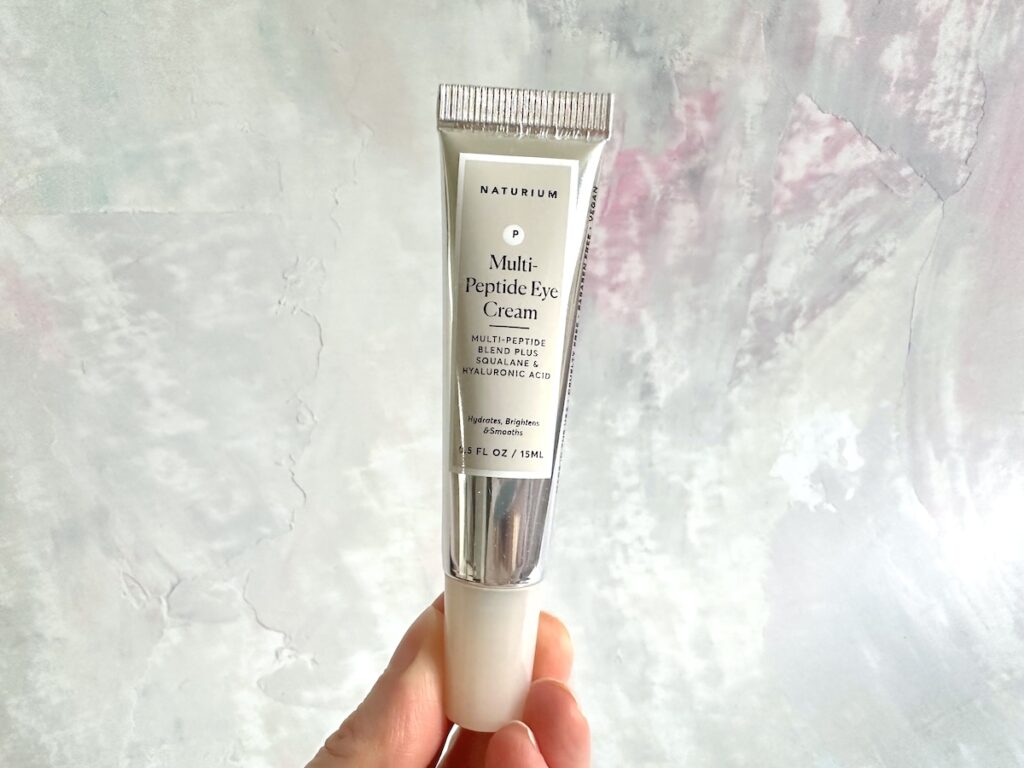 Naturium Multi-Peptide Eye Cream, handheld.