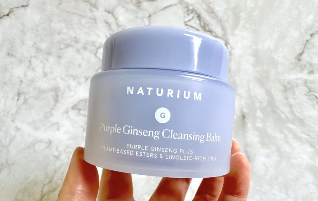 Naturium Purple Ginseng Cleansing Balm, handheld.