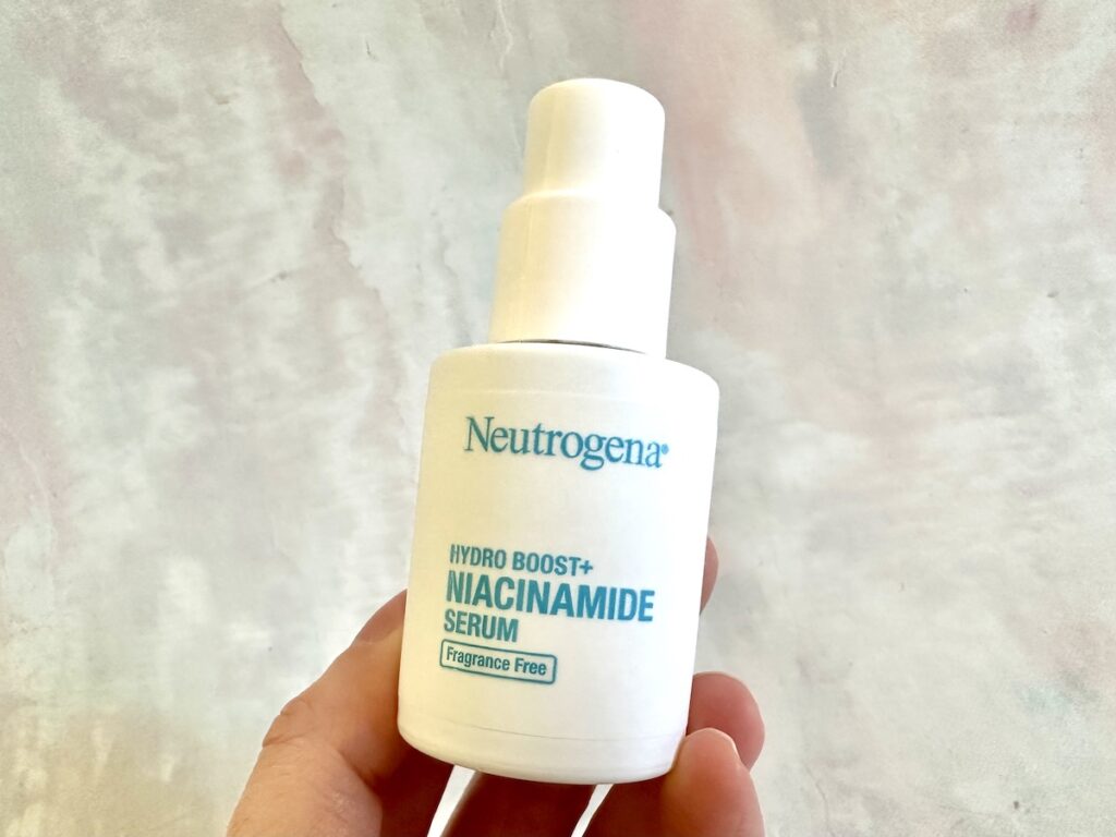 Neutrogena Hydro Boost+ Niacinamide Serum, handheld.